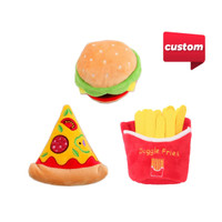 Three brightly coloured squeaky pet toys shaped like a hamburger, pizza slice, and fries in a red container.