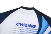 A cycling jersey in white, navy, and blue, featuring a logo and sleek design.