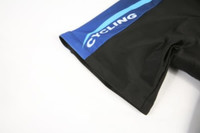 A cycling jersey featuring a black base with blue accents and a logo on the side.