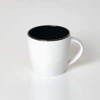 A coffee mug in matte white with a black interior and rim, featuring a logo on the surface.