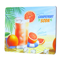 A vibrant mouse pad featuring a refreshing grapefruit soda, with tropical fruits and a beach scene in bright colours.