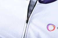 A white cycling jersey with short raglan sleeves, featuring a stand collar and a zippered front. It has a logo on the fabric.