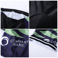 Men's sublimated cycling shorts featuring a black base with green and purple patterns, and a logo.