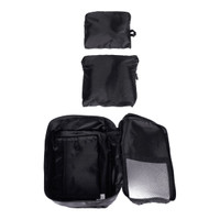 Three black packing cubes of varying sizes, with one open to reveal internal compartments, displaying a zippered design.