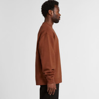 A brown sweater displayed on a model from the side view, featuring a relaxed fit and long sleeves.