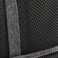 Black mesh fabric detail with stitching from a backpack, featuring a textured pattern and reinforcement tape.