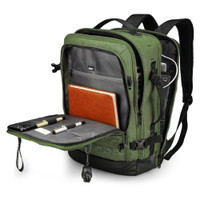 Green backpack with multiple compartments, open to show organized storage for pens, notebook, and accessories.