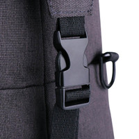 A close-up of a dark grey duffle bag featuring a black plastic buckle and strap.
