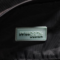 A close-up of the interior of a black duffle bag featuring a branded logo tag.