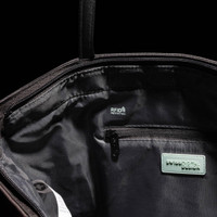 An interior view of a black tote bag featuring RFID protection, a zip pocket, and branding.