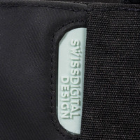 A black tote bag featuring a light blue branding label, made with a durable fabric.