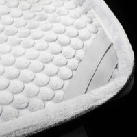 A close-up of a white padded interior of a laptop sleeve, featuring a textured surface and elastic straps.