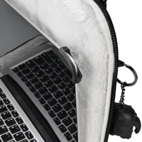 A laptop sleeve in grey with a plush interior and a keychain attachment. It features a black logo.