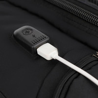 A black backpack featuring a USB charging port, made from durable fabric with a sleek design.