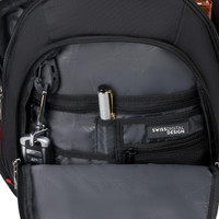 An inner pocket of a black backpack featuring compartments for a pen, keys, and a small device.