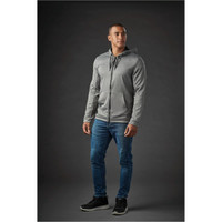 A grey zip-up hoody with a hood, paired with blue jeans, worn by a model against a dark background.