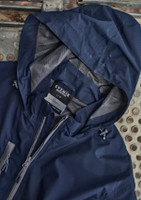 A navy unisex packable rain jacket featuring a hood, mesh lining, and a label. It includes a branding logo.
