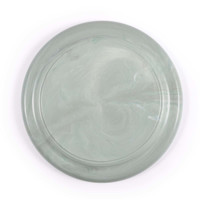 A frisbee featuring a marbled green design, showcasing a smooth finish with subtle swirling patterns.