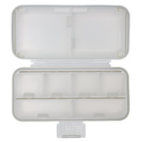 A white compact pill organizer with multiple compartments, featuring a hinged lid and a clean, minimalist design.