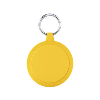 A round yellow keychain with a textured edge and a metal ring for attachment.
