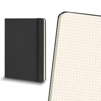 A large black Moleskine hard cover notebook featuring grid pages and an elastic band closure.