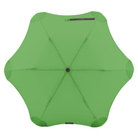 A green BLUNT Metro Umbrella with a unique, aerodynamic shape and a central button mechanism, featuring a logo.
