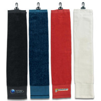 Four golf towels in different colours: black, navy, red, and white, each with a clip and logo.