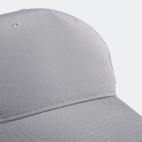 A grey Adidas performance golf cap featuring a smooth, sleek design and a branded logo.