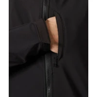 Close-up view of the black men's softshell jacket featuring a zippered hand pocket, adjustable hook-and-loop cuff tab, and durable weather-resistant fabric.