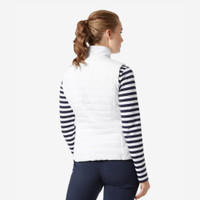 Woman wearing a white quilted Helly Hansen vest and striped long-sleeve shirt, viewed from the back.