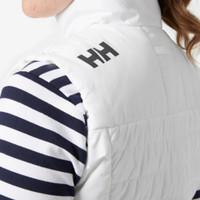 White Helly Hansen vest with black logo on shoulder, worn over a striped shirt.