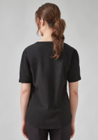 A black short sleeve blouse with a textured finish, featuring a relaxed fit and a simple design.