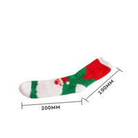 A green and white coral fleece sock with red accents, featuring a festive holiday design and a logo.