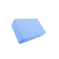 A blue EVA yoga block with a parallelogram shape, featuring a smooth surface and a small logo.