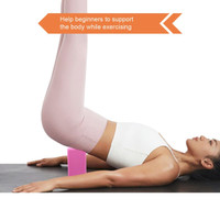 A pink EVA yoga block on a mat supporting a person performing an exercise. The individual wears light-coloured activewear.