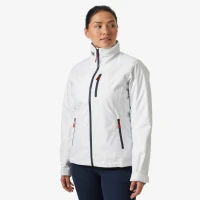 Front lifestyle view of the Crew Women's Midlayer Jacket 2.0 in white, featuring a full-length zipper, stand-up collar, vertical zippered chest pocket, zippered hand pockets with contrasting pulls, and a tailored performance fit.
