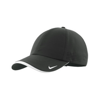 A dark grey perforated cap with white accents and a logo, designed for moisture management.