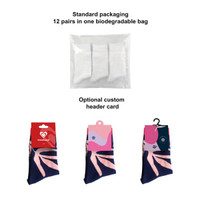 Woven socks in blue with a patterned design, packaged in a biodegradable bag, featuring an optional custom header card.