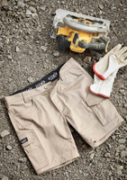 Mens Essential Stretch Cargo Shorts in beige, laid out on gravel, alongside a power tool and gloves. Features branding.