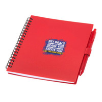 A red spiral-bound journal with a pen, featuring a branded design on the cover.