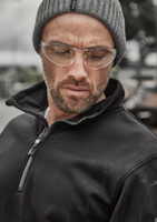 A black water-resistant pullover featuring a 1/4 zip and a collar, worn by a man with glasses and a grey beanie.