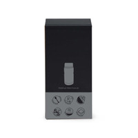 A food jar in a sleek black box, featuring a logo and various icons on the packaging.