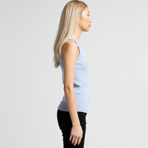 A side view of a light blue organic rib tank top worn by a model, with a fitted silhouette. The top has a logo. A side view of a light blue organic rib tank top worn by a model, with a fitted silhouette. The top has a logo.