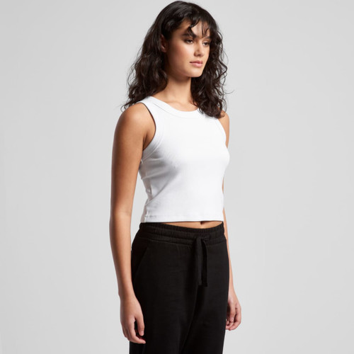 A white organic rib crop tank top displayed on a model, paired with black trousers. Features a logo. A white organic rib crop tank top displayed on a model, paired with black trousers. Features a logo.