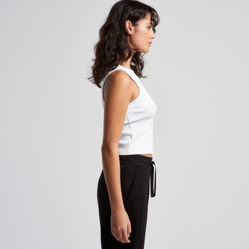A white organic rib crop tank top displayed on a model, featuring a simple design and fitted style. A white organic rib crop tank top displayed on a model, featuring a simple design and fitted style.