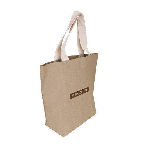 A large, beige washable Kraft paper bag with cotton handles and a logo. A large, beige washable Kraft paper bag with cotton handles and a logo.
