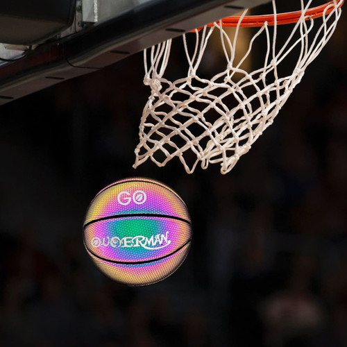 A holographic glowing basketball in a rainbow of colours, poised to go through a basketball hoop.