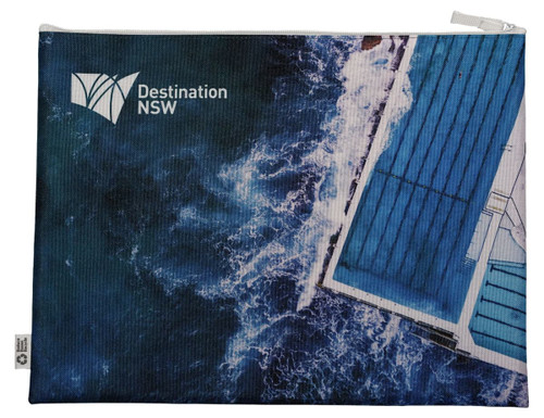 A blue conference bag featuring a water and pool design, with a logo in the corner.