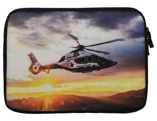 A laptop sleeve featuring a helicopter graphic with a sunset backdrop, predominantly in black and white. A laptop sleeve featuring a helicopter graphic with a sunset backdrop, predominantly in black and white.
