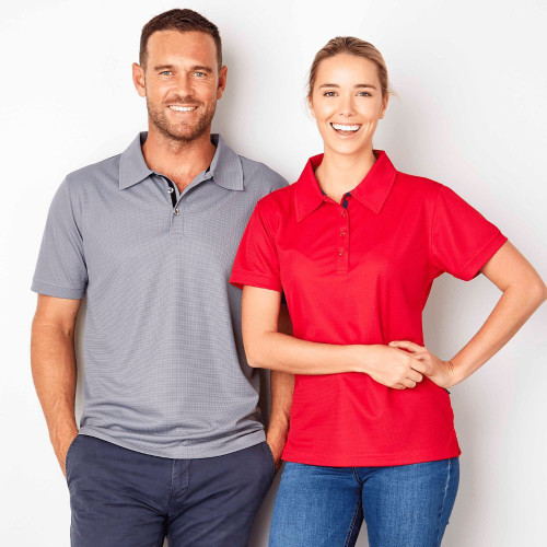 A man wearing a grey polo shirt and a blond woman wearing a red polo shirt.